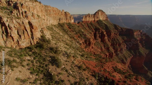 Beautiful aerial over Grand Canyon rim at dawn.