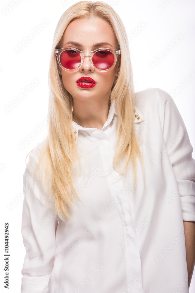 Beautiful blonde girl in pink glasses and shirt. Beauty face. Isolated on white background. Beautiful blonde girl in pink glasses and shirt. Beauty face. Isolated on white background.