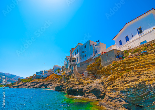 beautiful old houses by the sea at Chora, the capital of Andros island in Greece photo