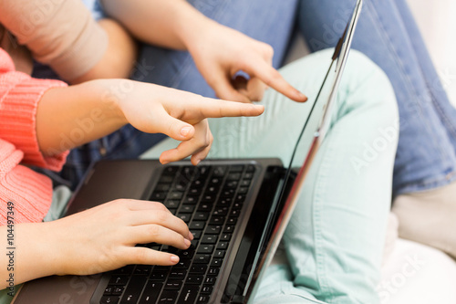 close up of women or friends with laptop at home