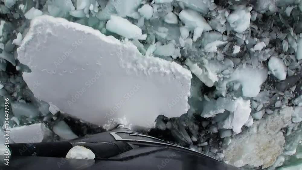 Basic Ice Views Bow of Icebreaker Ship breaks the ice. Top view. Ice floats and and ...