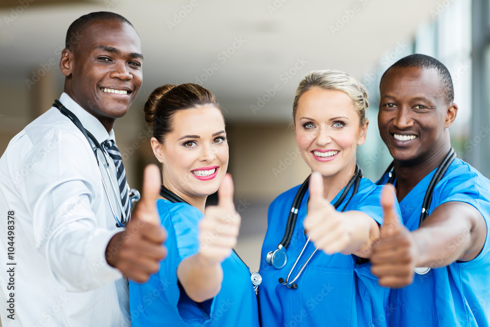 Obraz premium group of healthcare workers thumbs up