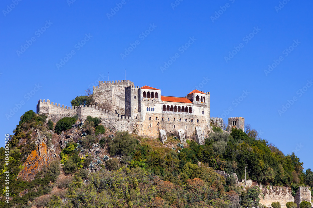 The Leiria Castle built on top of a hill with a view over the gothic Palatial Residence area (Pacos Novos). Leiria, Portugal.