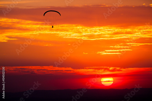 Paragliding in sunset