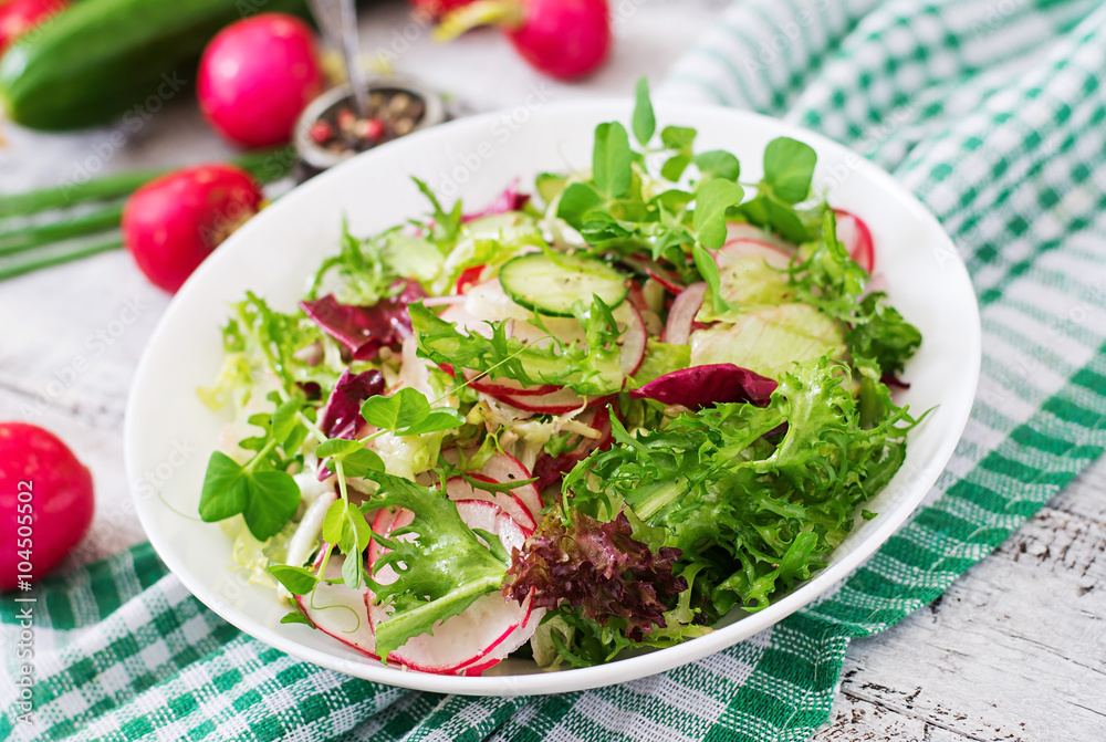 Fresh salad of cucumbers, radishes and herbs