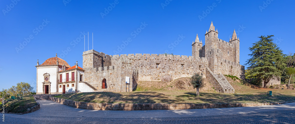 Santa Maria da Feira, Portugal - October, 2015: The Feira Castle with Nossa Senhora da Esperanca Chapel on the left.