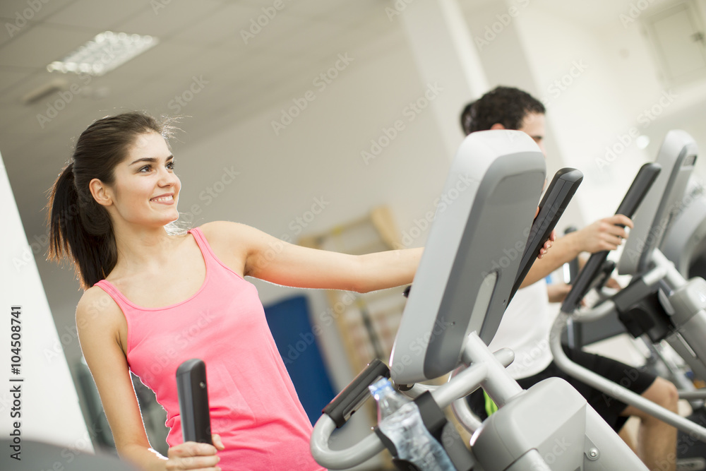Young people training in the gym Young people training in the gym
