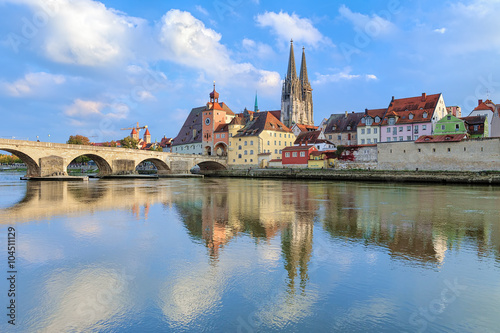 View from Danube on Regensburg Cathedral and Stone Bridge in Regensburg, Germany photo
