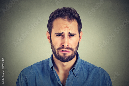 Foto Portrait of a sad young man.