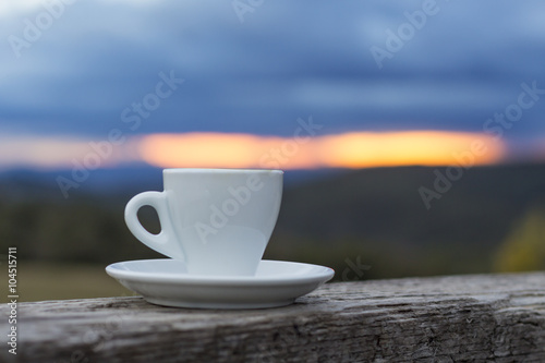 Coffee cup put on the wooden fence