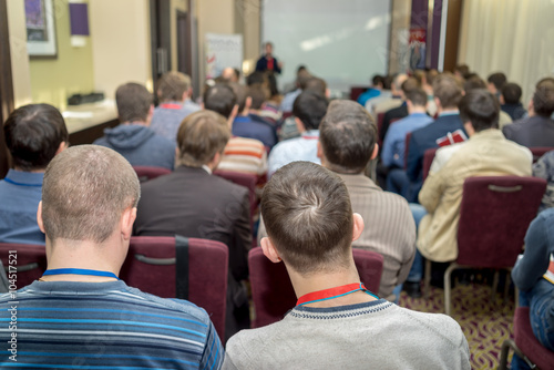 Speaker Giving a Talk at Business Meeting.