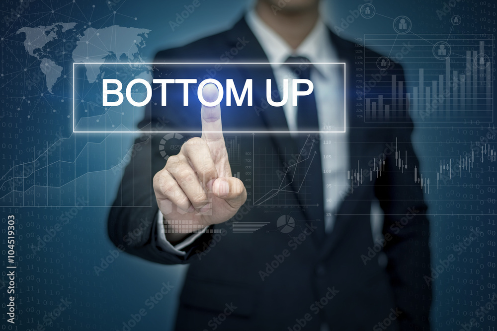 Businessman hand touching BOTTOM UP button on virtual screen Businessman hand touching BOTTOM UP button on virtual screen