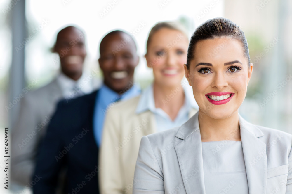 young businesswoman standing in a row young businesswoman standing in a row