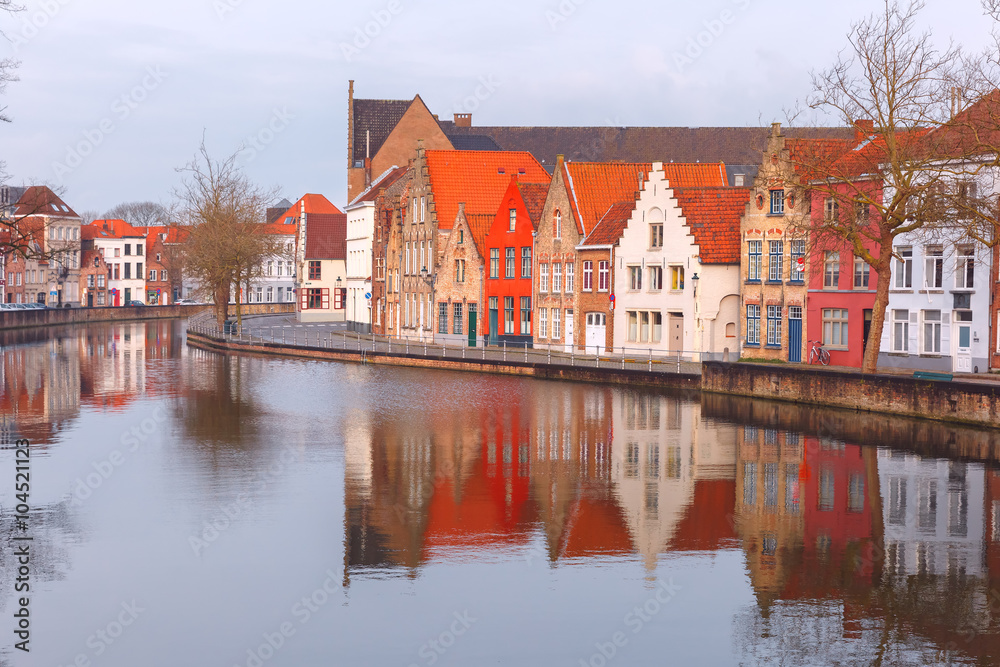 Scenic city view of Bruges canal with beautiful medieval houses, Belgium