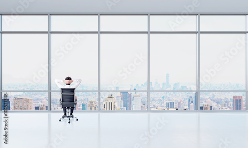 Man looking into window and thinking © ImageFlow