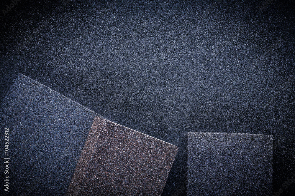 Fototapeta premium three abrasive sponges on sandpaper