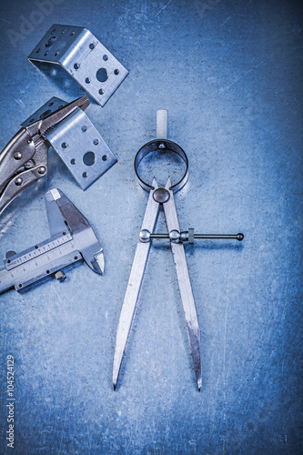 фотографія Metal lock jaw pliers trammel caliper drilled angle bars constru