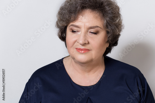portrait of beautiful elegant woman in a well-kept older srudii on a white background with makeup and without makeup