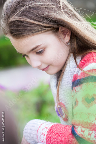 Spring fairy. Portrait of beautiful little smiling girl with brownish blond hair and blue eyes.  photo