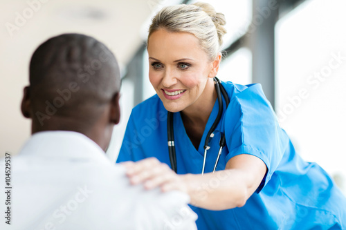 medical doctor comforting pateint photo