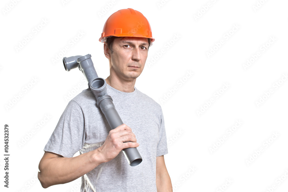 the young working plumber with the tool the young working plumber with the tool