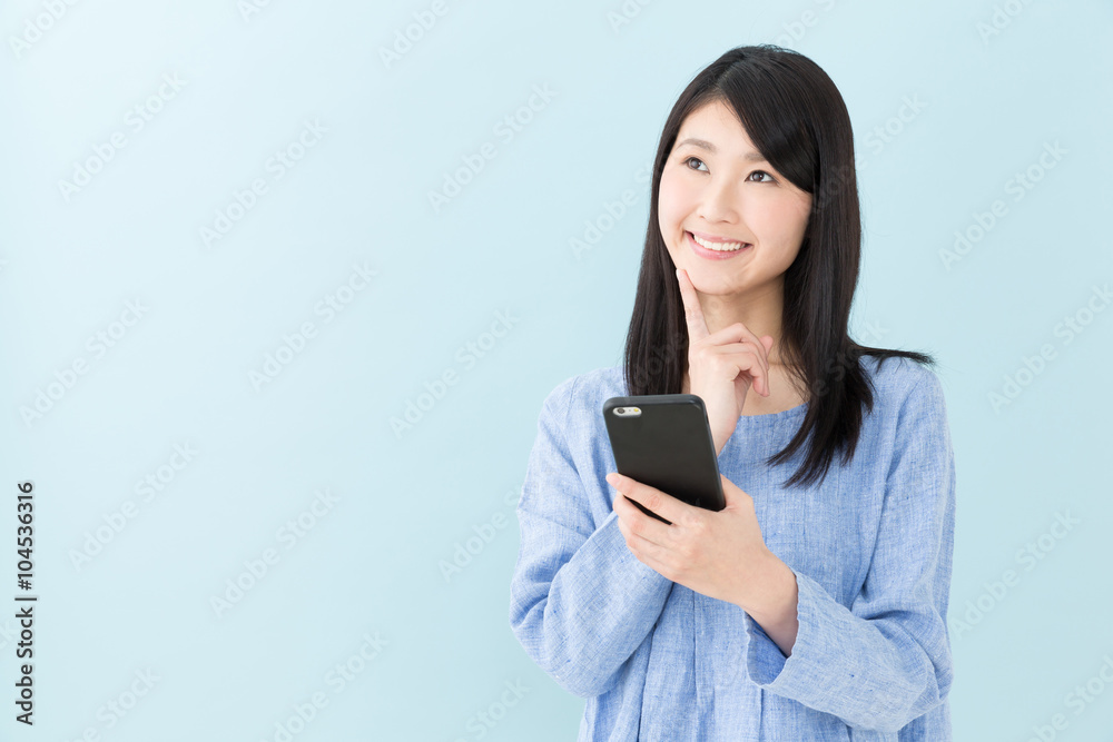 attractive asian woman on blue background attractive asian woman on blue background