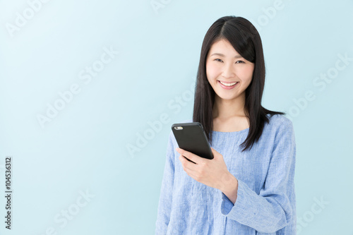 attractive asian woman on blue background