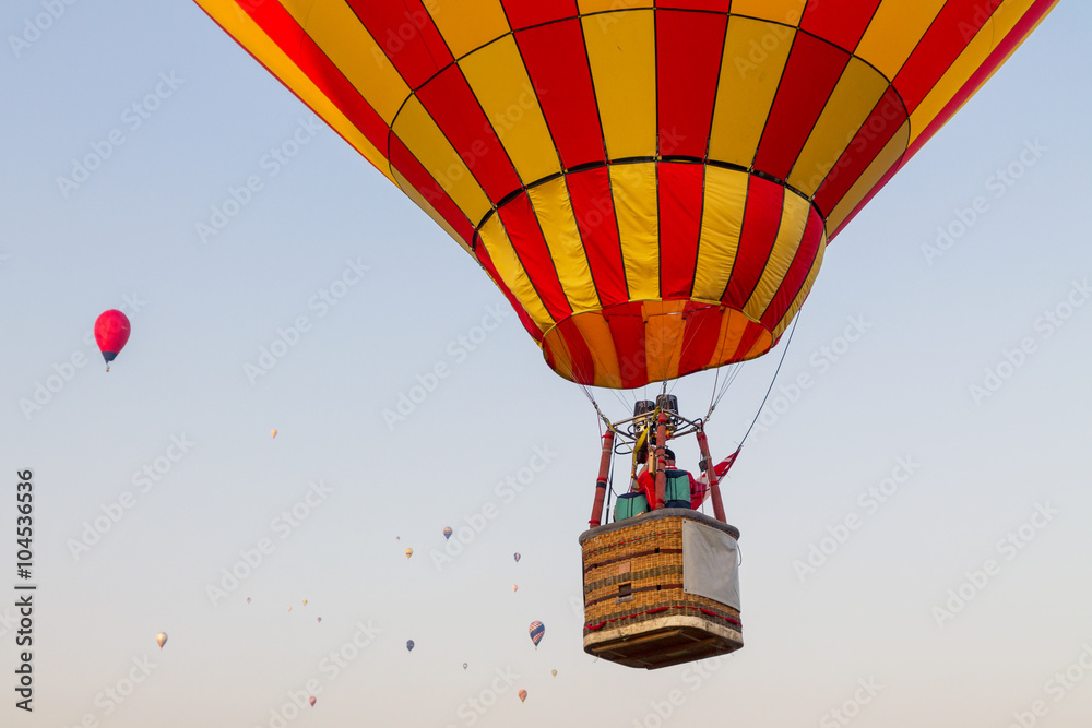 Fototapeta premium Colorful hot air balloon early in the morning
