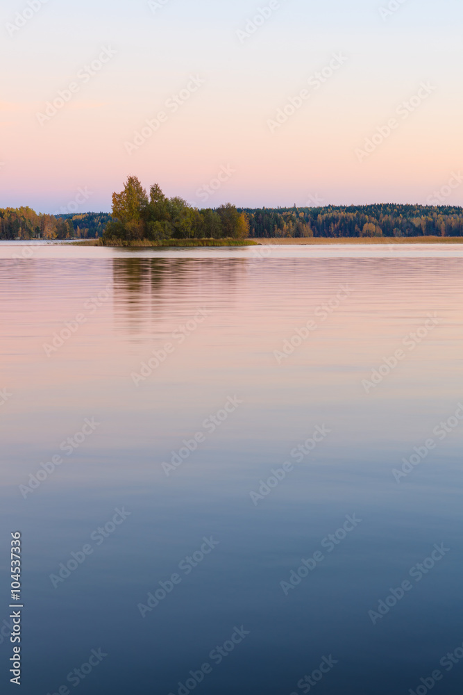 Fototapeta premium Serene lake scenery at dusk in Finland