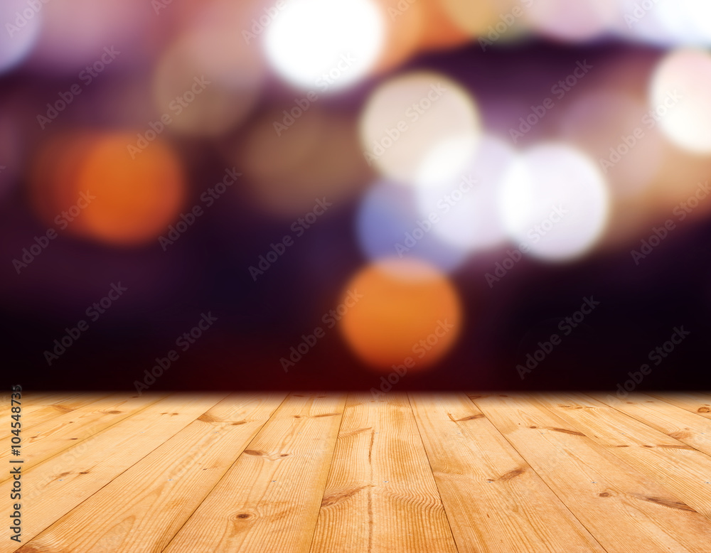 Colorful bokeh on wood stage background 
