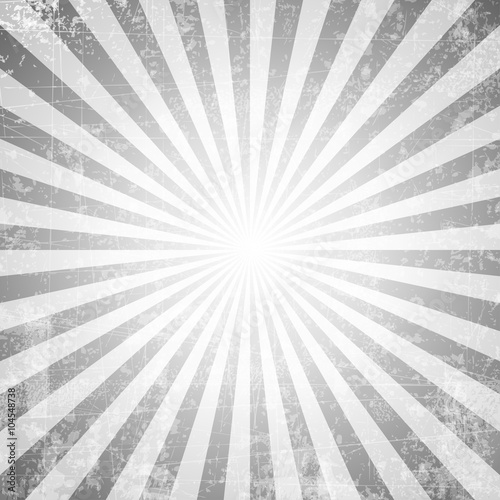 Grunge style abstract starburst & sunburst background with faded and desaturated soft tones
