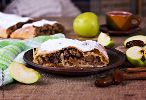 Apple strudel or apple pie with dates and cinnamon
