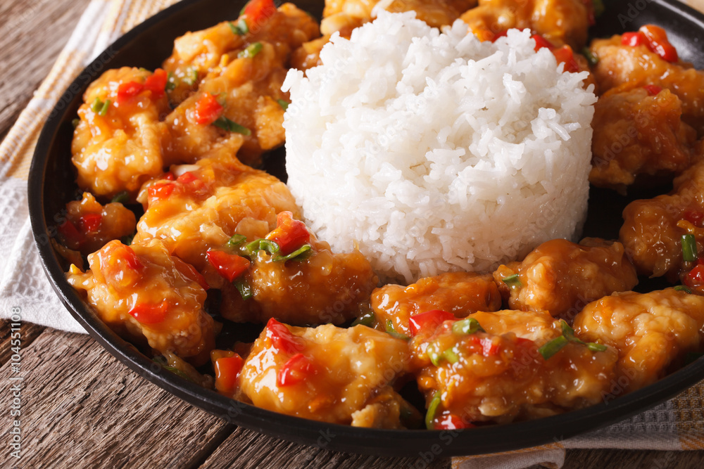 Orange chicken fillet with sauce and rice closeup. horizontal
Orange chicken fillet with sauce and rice closeup. horizontal