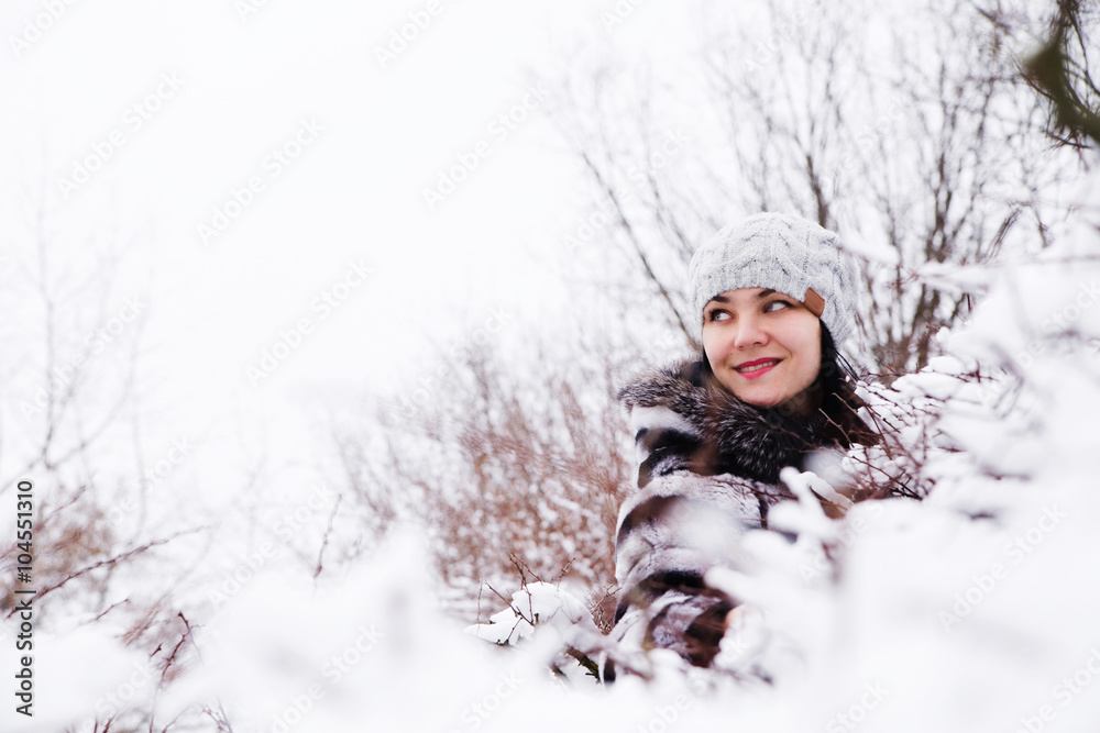 portrait of woman in a snow bushes portrait of woman in a snow bushes