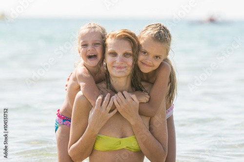 Mother and two daughters swimming in the sea © madhourse