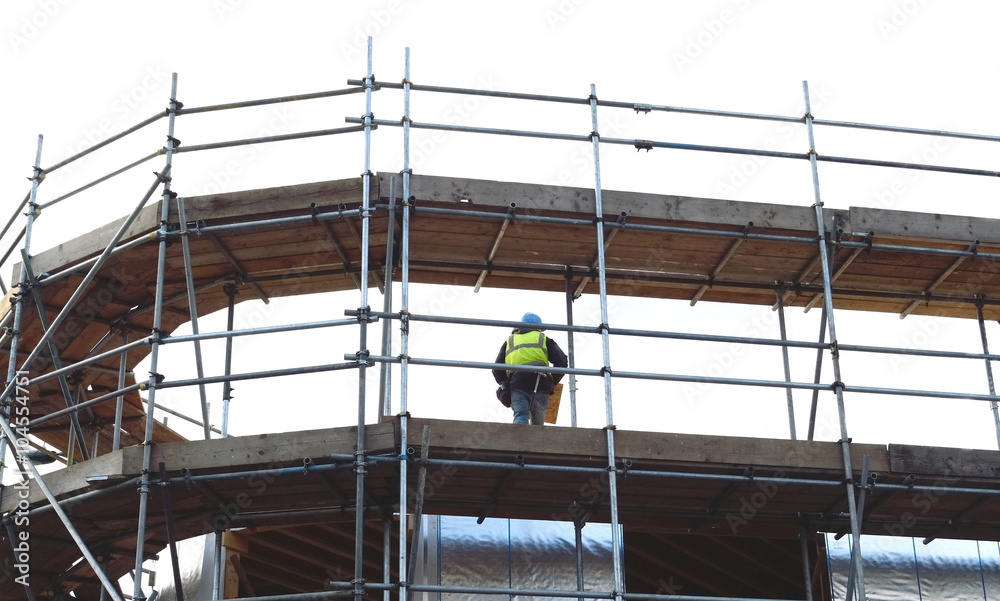 Scaffolding with worker on a platform