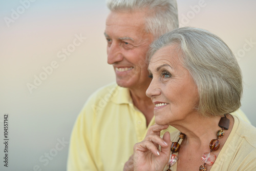 Happy senior couple near river