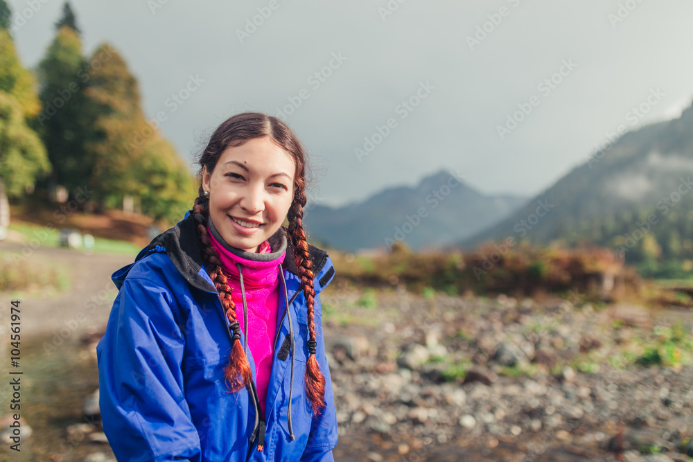 Young girl portrait in the mountains during hiking in Caucasus Young girl portrait in the mountains during hiking in Caucasus