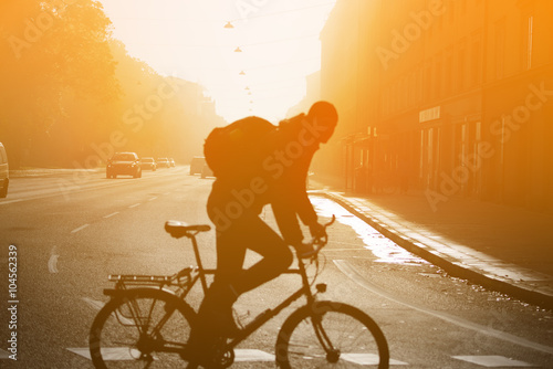 Photography Man in silhouette, foggy sunset in cental Stockholm, Sweden