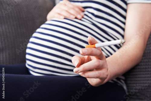 Obraz na plátně Close Up Of Pregnant Woman Smoking Cigarette