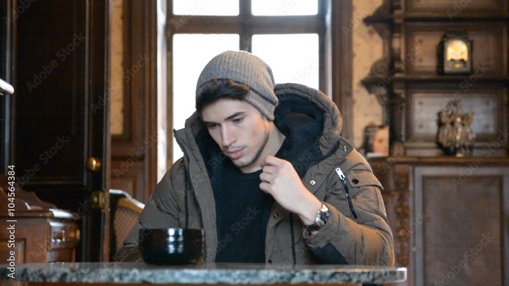Sad young man in winter clothes Sad young man in winter clothes