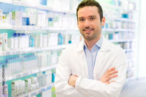 Young Attractive pharmacist at work photo