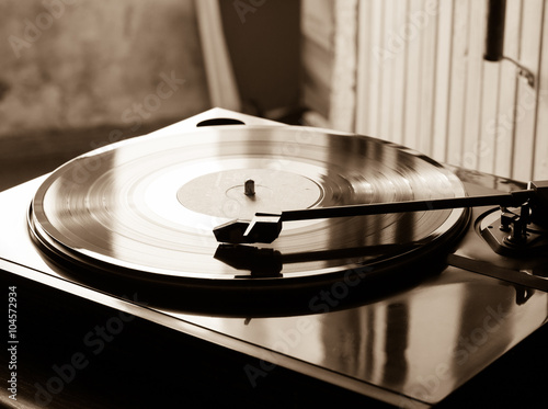 Vintage record player with vinyl disc, close-up