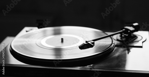 Vintage record player with vinyl disc, close-up