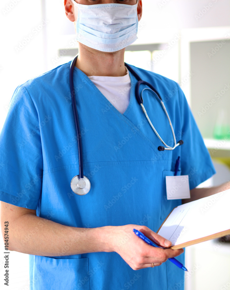 Closeup portrait of a doctor with stethoscope holding folder Closeup portrait of a doctor with stethoscope holding folder