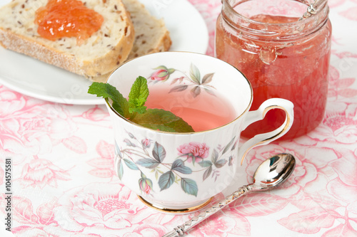 Watermelon Jam, Herbal Tea, Marshmallows. White Wooden Table
