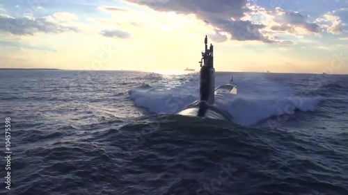 Excellent aerials over a submarine at sea. photo