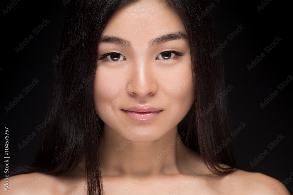 Close-up of smiling Asian woman in studio Close-up of smiling Asian woman in studio