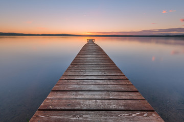Fotobehang Pier Oude pier in warm avondlicht  © Alexander Gogolin