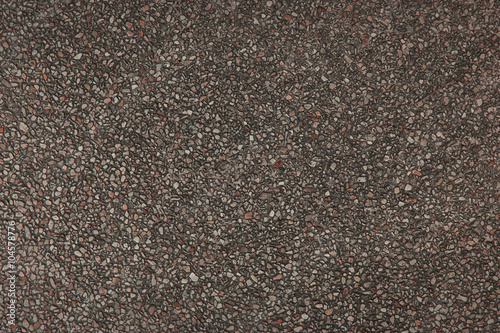 Explsed or exposed aggregate finish surface, red.